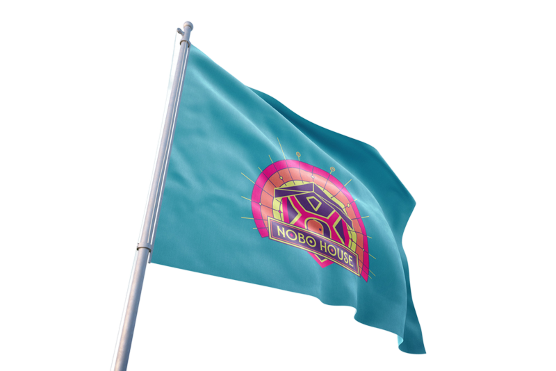 nobo-house-flag Teal flag on a silver pole shows a circular pink-yellow logo with the text 'NOBO HOUSE' waving in the wind, outdoors.
