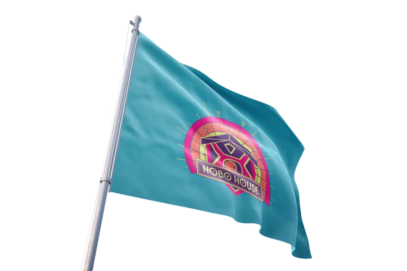 Nobo House Flag Blue flag with a colorful circular NOBO HOUSE logo on a flagpole waving in the wind.